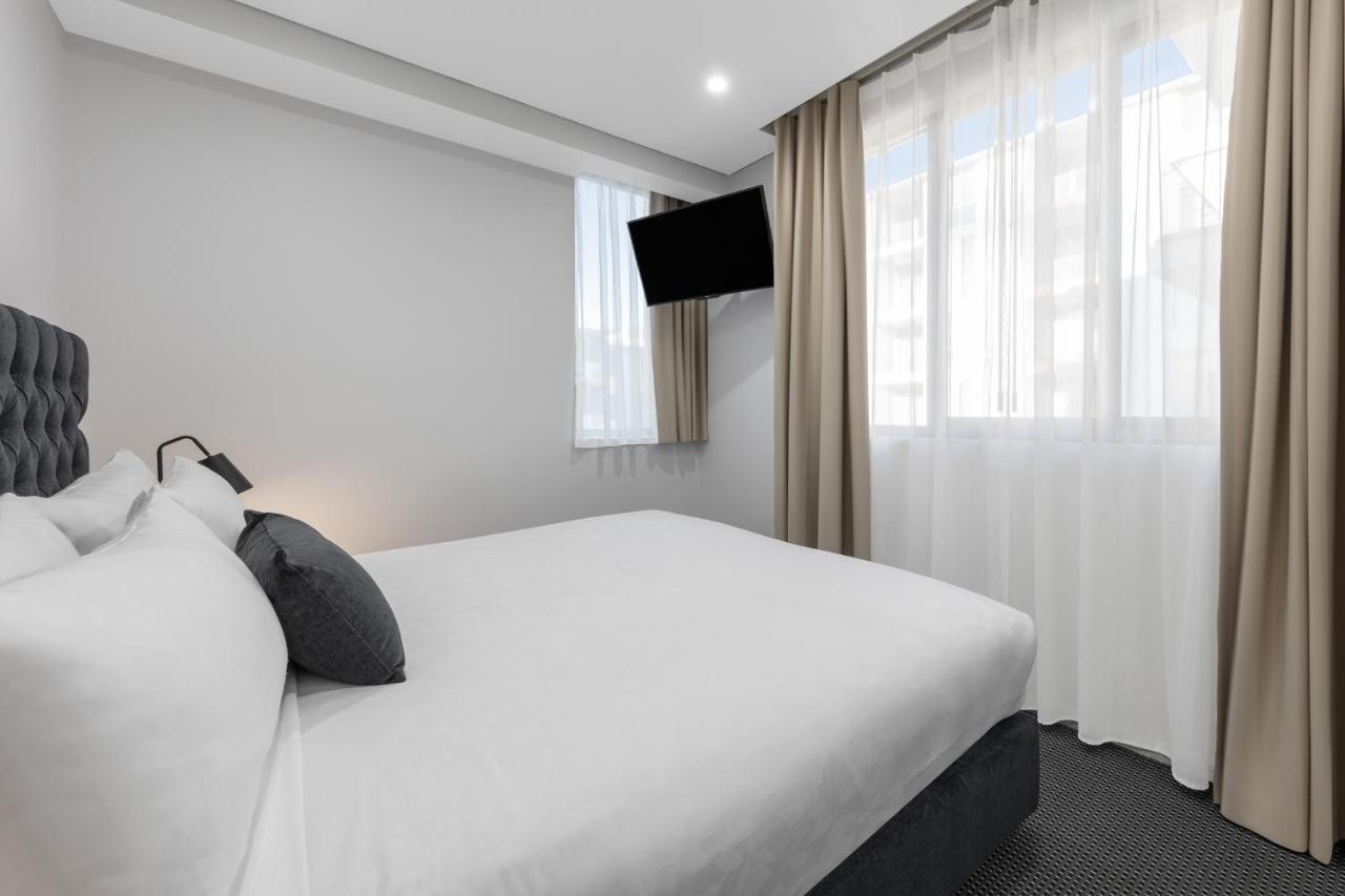 赖德北梅里顿公寓式酒店 悉尼 外观 照片 A bedroom at the hotel